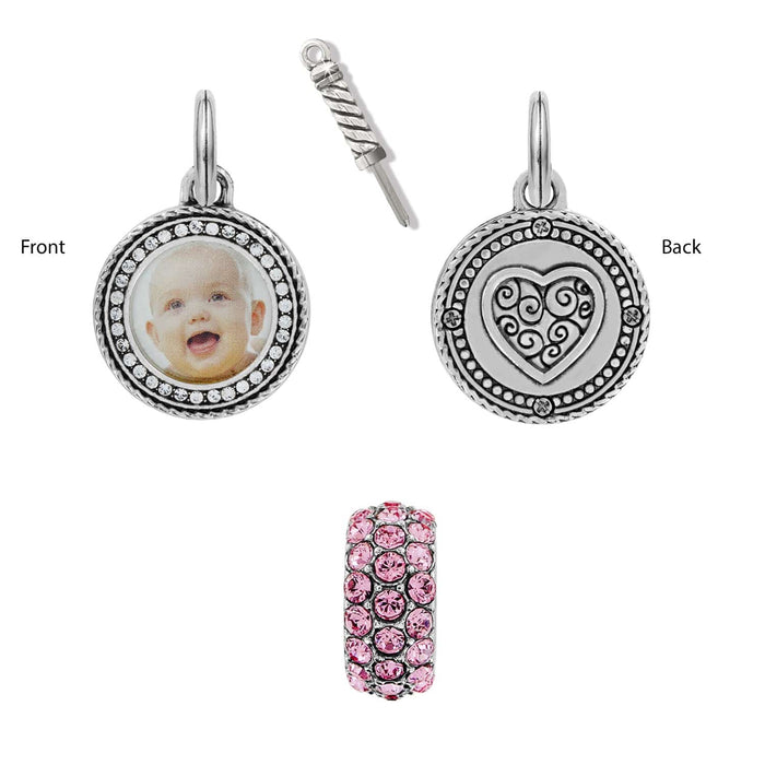 Brighton silver-plated charm set with photo frame, heart-engraved back, and pink crystal bead on a white background