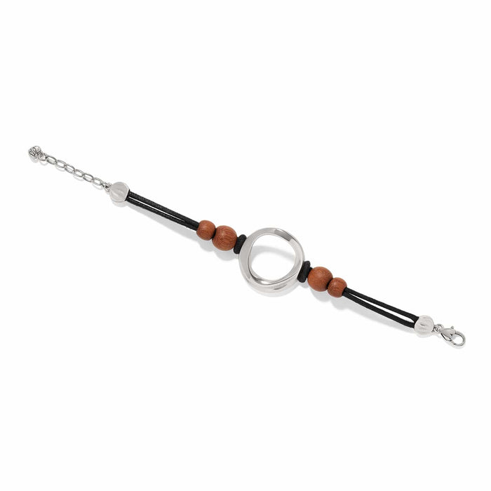 Brighton bracelet with silver-plated open circle centerpiece, wood beads, and black cord straps on a white background