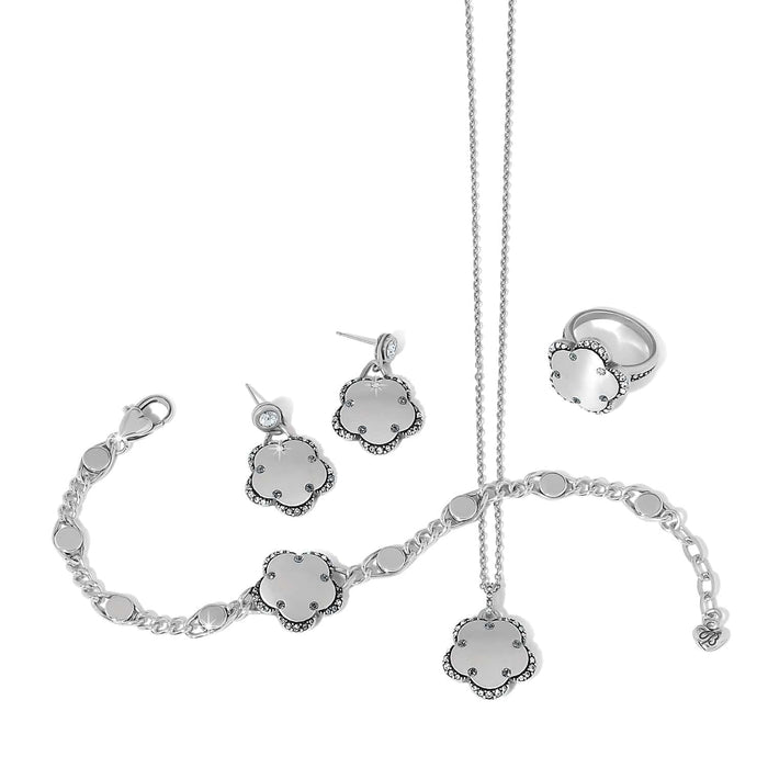 Brighton silver-plated jewelry set with floral charm bracelet, drop earrings, ring, and pendant necklace with crystals on a white background