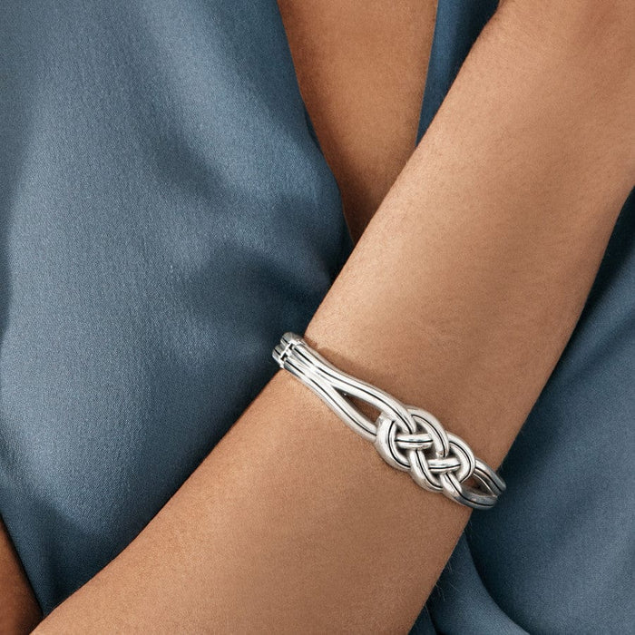 Models wrist wearing Interlok Hinged Bangle