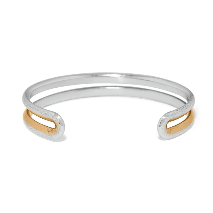 Brighton cuff bracelet with two-tone silver hammered band and gold-tone oval accents at open ends on a white background