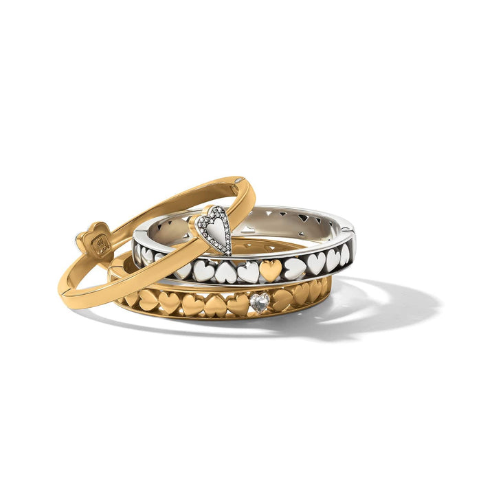 Brighton bangle bracelet set with gold-plated and silver-tone heart designs and crystal accents on a white background