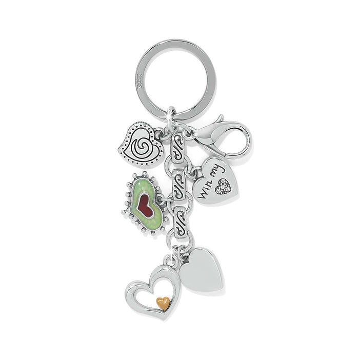 Brighton keychain with multiple silver-tone heart charms, green and red enamel accent, and crystal details on a white background
