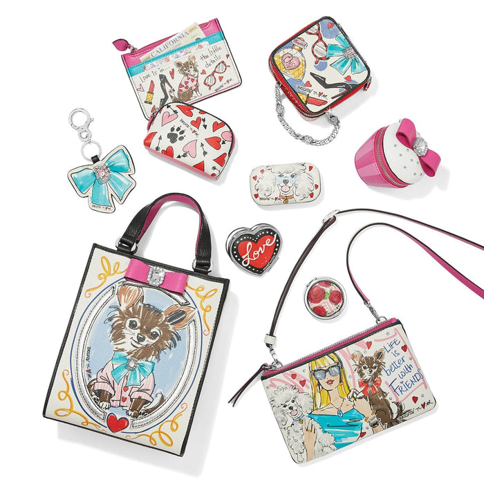 Brighton handbag collection styled with illustrated dog prints, coordinating pouches and other accessories on a white background