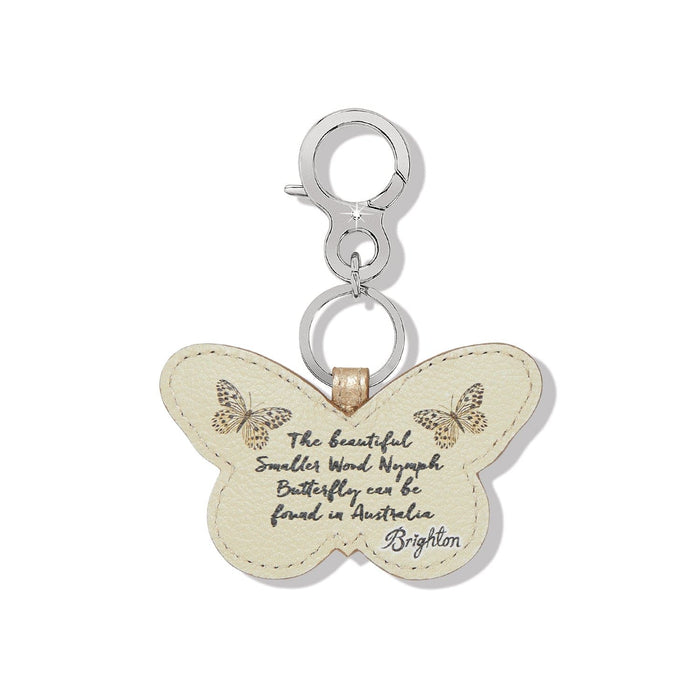 Brighton butterfly bag charm in cream leather with printed butterflies and script text on a white background