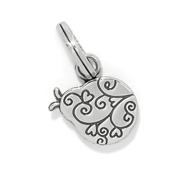 Brighton silver-plated charm with engraved swirl and heart scrollwork design on a white background