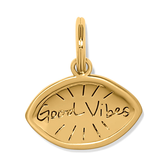 Brighton eye-shaped charm with gold-plated finish and engraved Good Vibes script with sunburst rays on a white background
