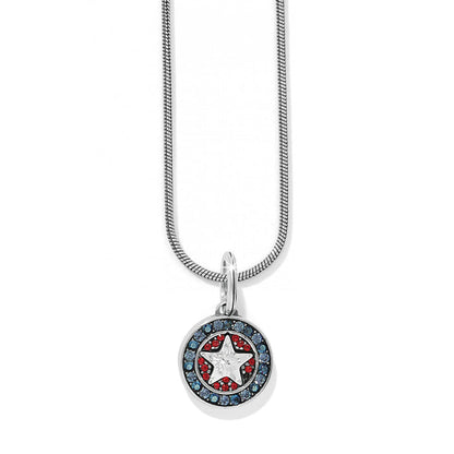 Brighton pendant necklace with silver-plated star medallion, red and blue crystals, and snake chain on a white background