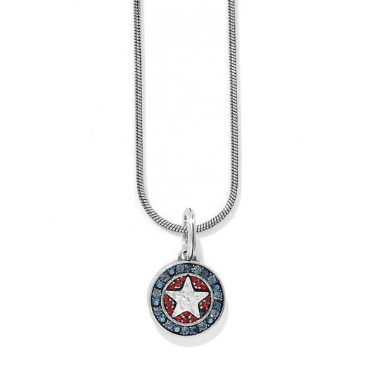 Brighton pendant necklace with silver-plated star medallion, red and blue crystals, and snake chain on a white background