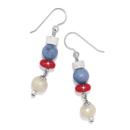 Brighton drop earrings with white, blue, red, and pearl beads and silver-plated hooks on a white background