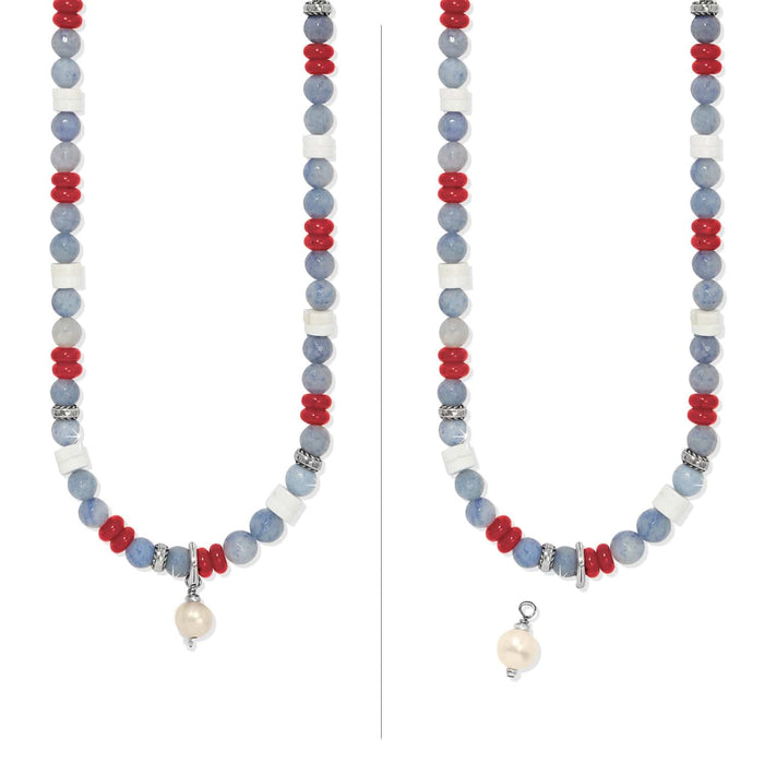 Brighton beaded necklace with blue, red, and white beads, silver-plated accents, and detachable pearl charm on a white background