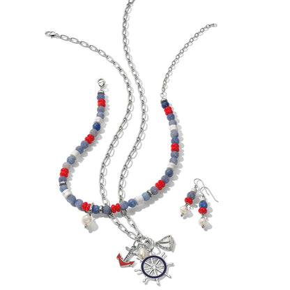 Brighton nautical jewelry set with silver-plated chain necklace, beaded necklace, and matching earrings featuring anchor and ship wheel charms