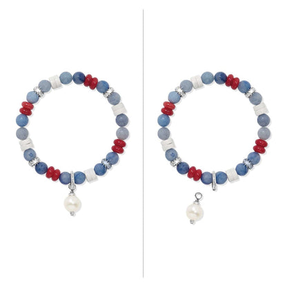 Brighton beaded bracelet with blue, red, and white beads, silver-plated accents, and pearl charm on a white background