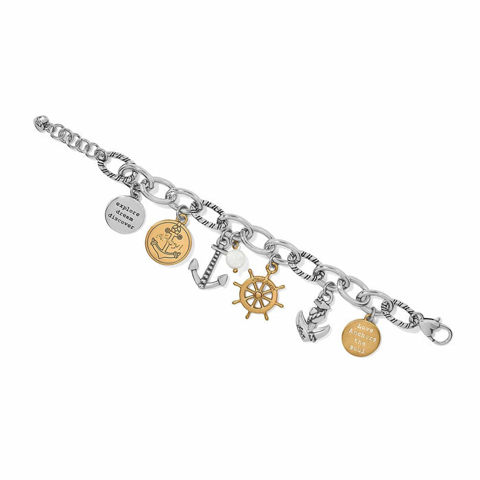Brighton charm bracelet with two-tone nautical anchor, ship wheel, mother-of-pearl bead, and engraved disc charms on a white background