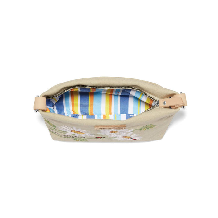 Brighton handbag shown open with floral embroidery, blue and orange striped interior lining, and zipper closure on a white background
