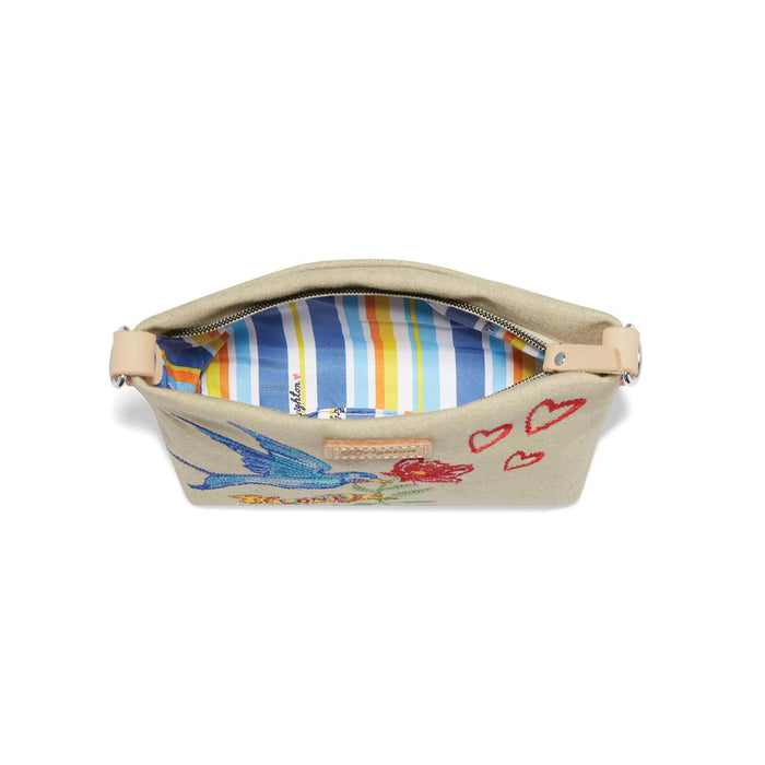 Brighton canvas handbag shown open with striped interior lining, embroidered bird, flower, and heart details on a white background