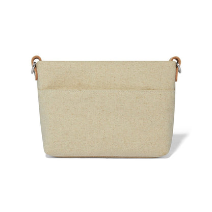 Brighton handbag organizer insert in beige canvas with front pocket and leather strap loops on a white background