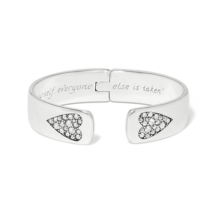 Brighton hinged cuff bracelet with silver-plated finish, crystal heart accents, and engraved interior message on a white background