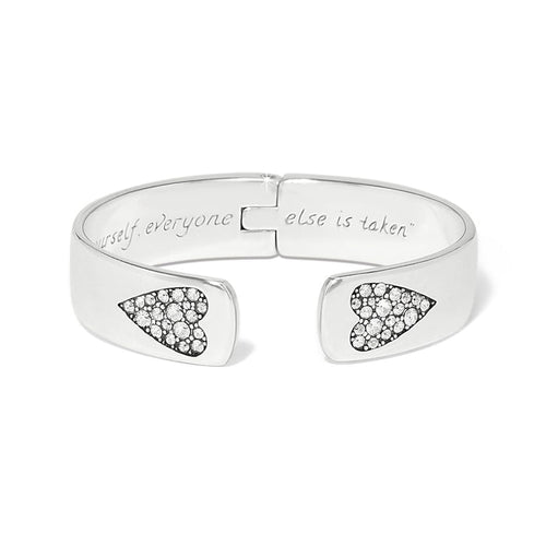 Brighton hinged cuff bracelet with silver-plated finish, crystal heart accents, and engraved interior message on a white background