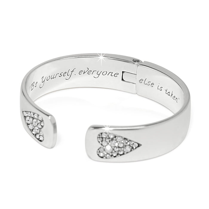 Brighton silver-plated hinged cuff bracelet with crystal heart accents and engraved inscription inside on a white background