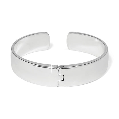 Brighton silver-plated cuff bracelet with smooth polished finish and hinged opening on a white background