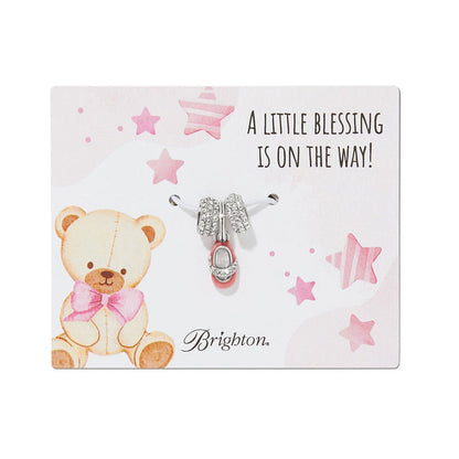 Brighton charm set with silver-plated crystal beads and pink enamel baby shoe on illustrated teddy bear card background