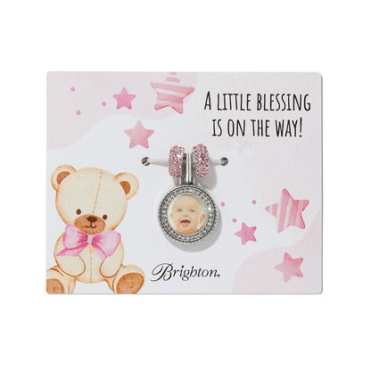 Brighton silver-plated charm with crystal-framed baby photo and pink crystal beads on pink teddy bear card on a white background
