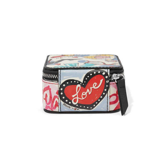 Brighton jewelry case with illustrated heart print, Love graphic, black trim, and zip closure on a white background