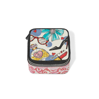 Brighton zippered jewelry case with illustrated print of perfume, heels, sunglasses, and hearts on a white background