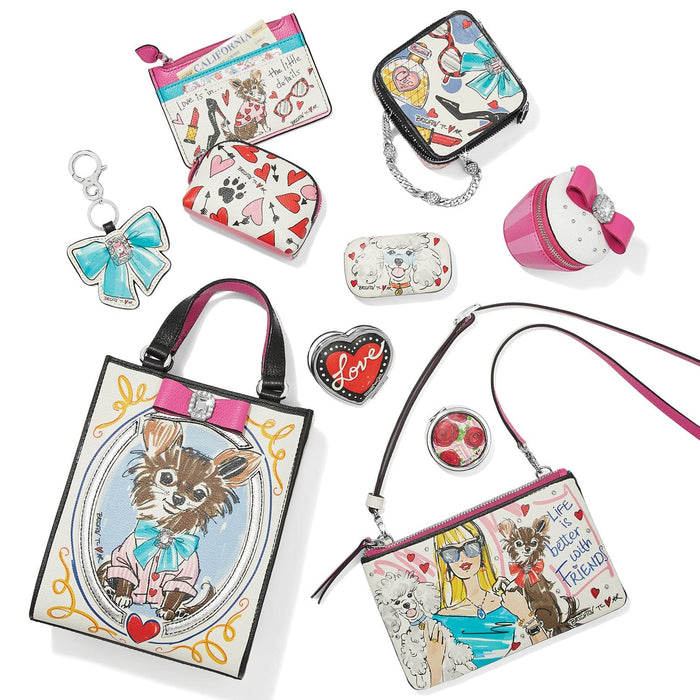 Brighton handbag collection styled with illustrated dog prints, hearts, and coordinating accessories on a white background