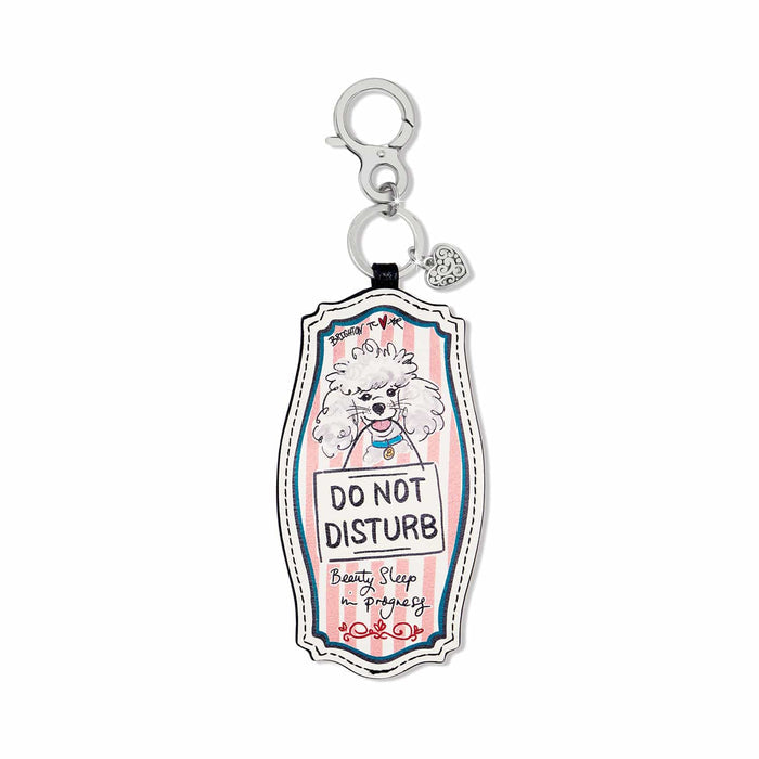Brighton leather bag charm with poodle illustration and Do Not Disturb print, silver-tone clasp on white background
