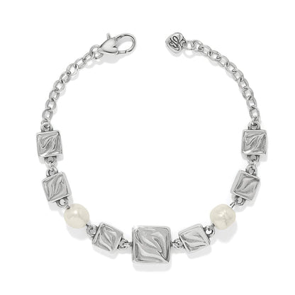 Brighton bracelet with silver-plated textured square links, barque pearl beads, and lobster clasp on a white background