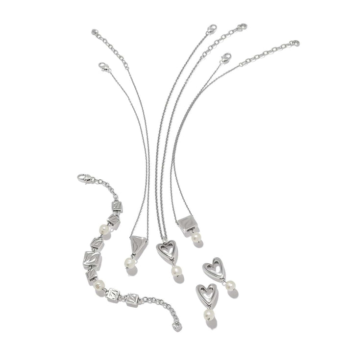 Brighton silver-plated jewelry set with heart drop earrings, pendant necklaces, and bracelet with barque pearls on a white background