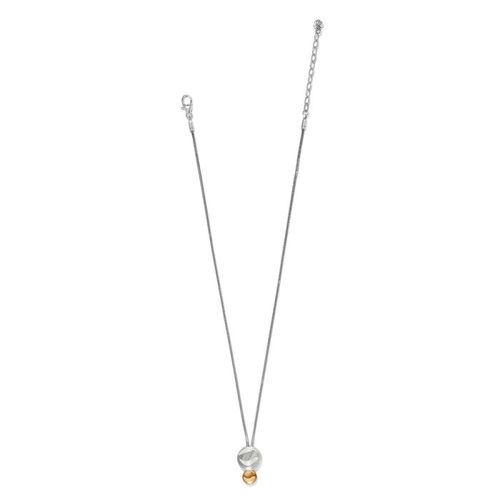 Brighton pendant necklace with two-tone silver disc and gold bead drop on a thin chain on a white background