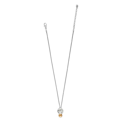 Brighton pendant necklace with two-tone silver disc and gold bead drop on a thin chain on a white background