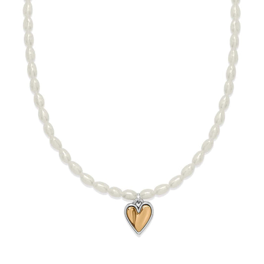 Brighton pearl necklace with rice pearls and two-tone heart pendant in silver and gold on a white background