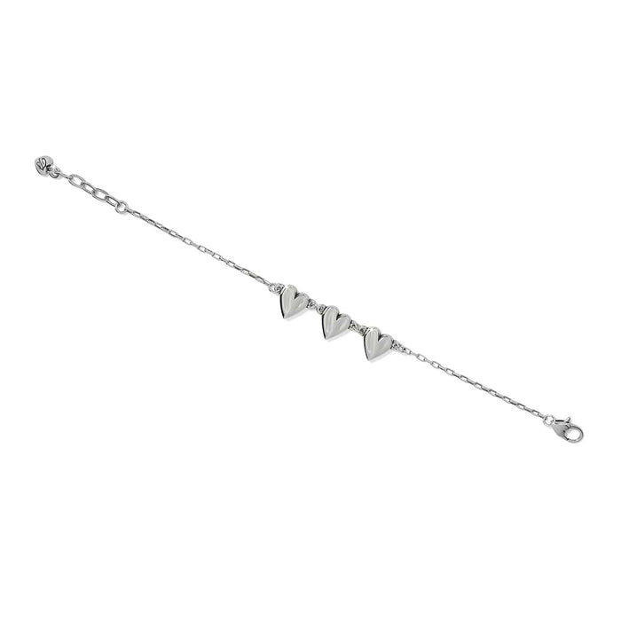 Brighton bracelet with three silver-tone heart charms, delicate chain, and lobster clasp on a white background