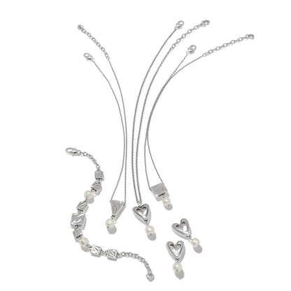 Brighton silver-plated jewelry set styled with barque pearl accents and heart and square motifs on a white background
