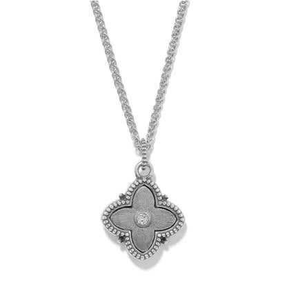 Brighton pendant necklace with quatrefoil medallion, beaded border, and central crystal accent on a white background