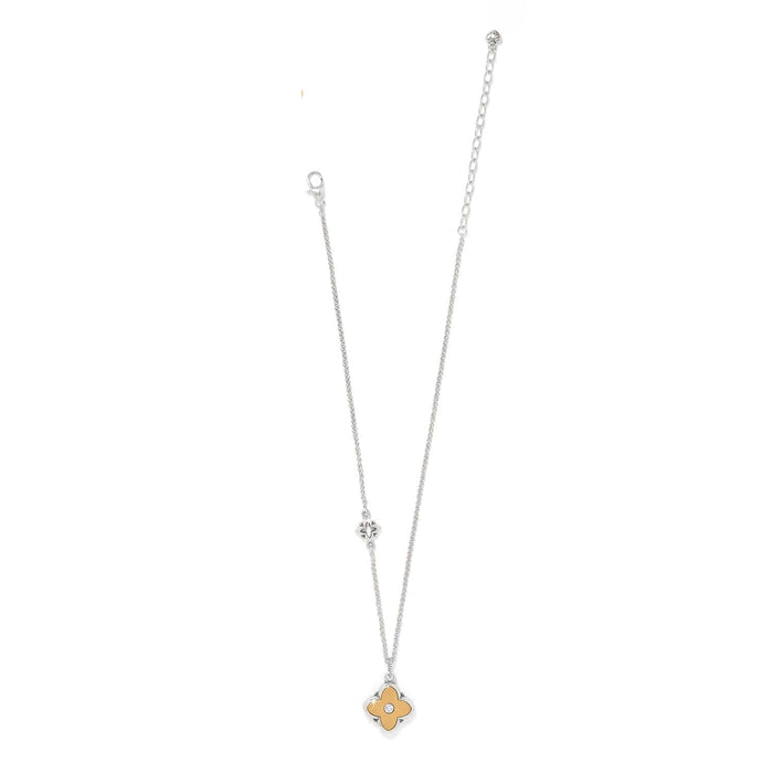 Brighton silver-tone necklace with two-tone clover pendant, crystal accent, and adjustable chain on a white background
