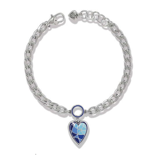 Brighton charm bracelet with silver-plated curb chain and blue enamel heart pendant on a white background