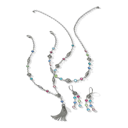 Brighton silver-plated jewelry set with multicolor crystals, tassel pendant necklace, bracelet, and drop earrings on a white background