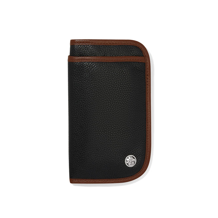 Brighton wallet in black pebbled leather with brown trim and silver-plated medallion accent on a white background