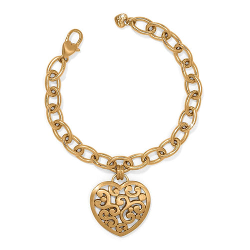 Brighton charm bracelet with gold-plated chain links and ornate filigree heart pendant on a white background