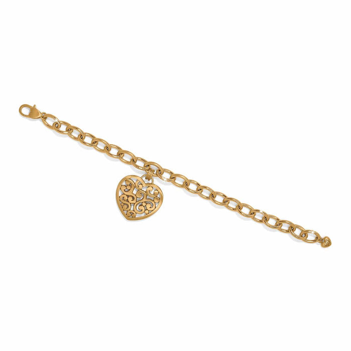 Brighton charm bracelet with gold-plated chain links and ornate filigree heart pendant on a white background