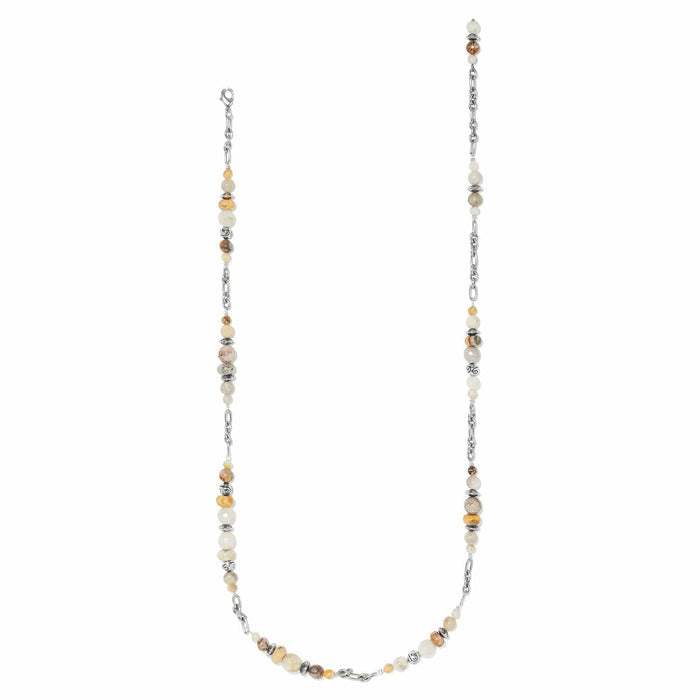 Brighton long beaded necklace with cream and amber stones, silver-plated chain links and accents on a white background