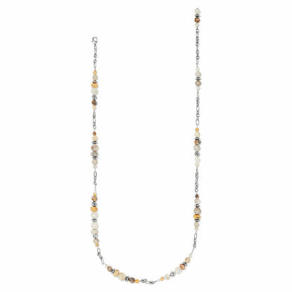 Brighton long beaded necklace with cream and amber stones, silver-plated chain links and accents on a white background