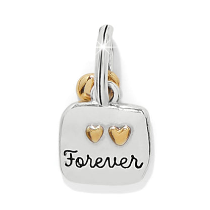 Brighton charm with silver-tone square engraved Forever and two gold-tone hearts on a white background