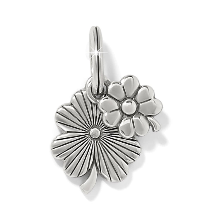 Brighton charm with silver-plated four-leaf clover and flower design featuring textured and polished details on a white background
