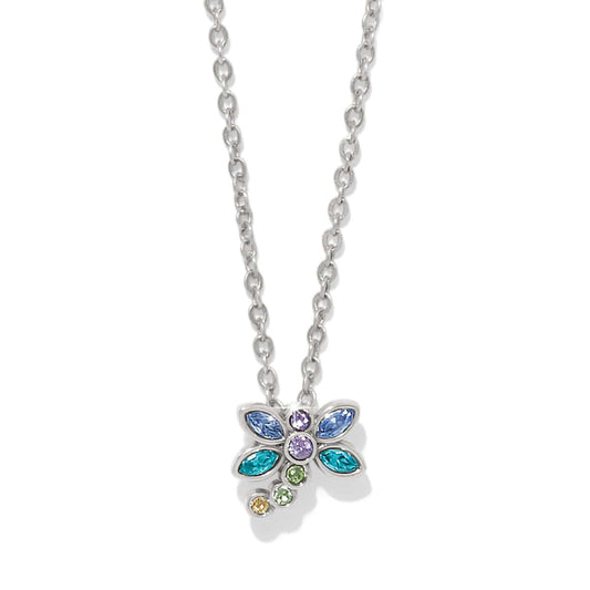 Brighton pendant necklace with silver-plated dragonfly featuring blue, purple, teal, and green crystals on a white background